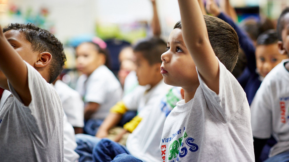 Students raising hands