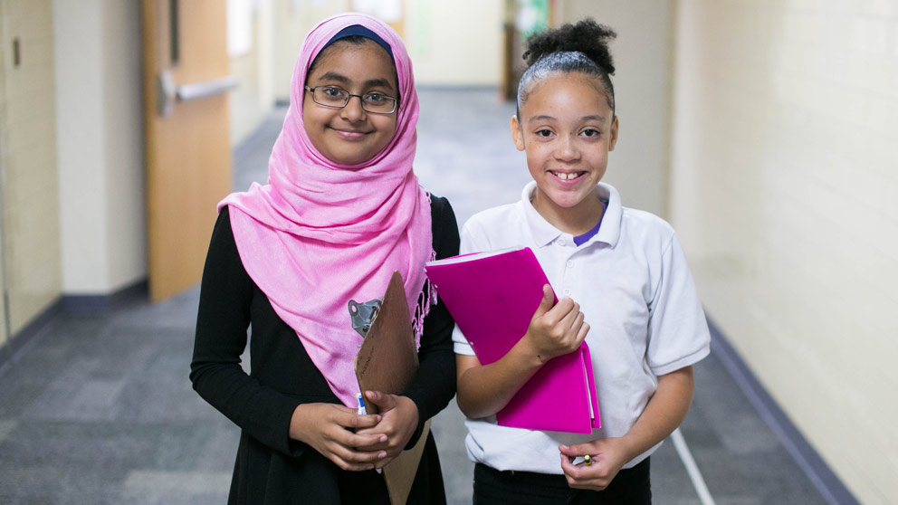 Two students smiling