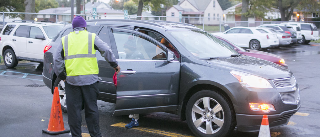 Helping student out of car