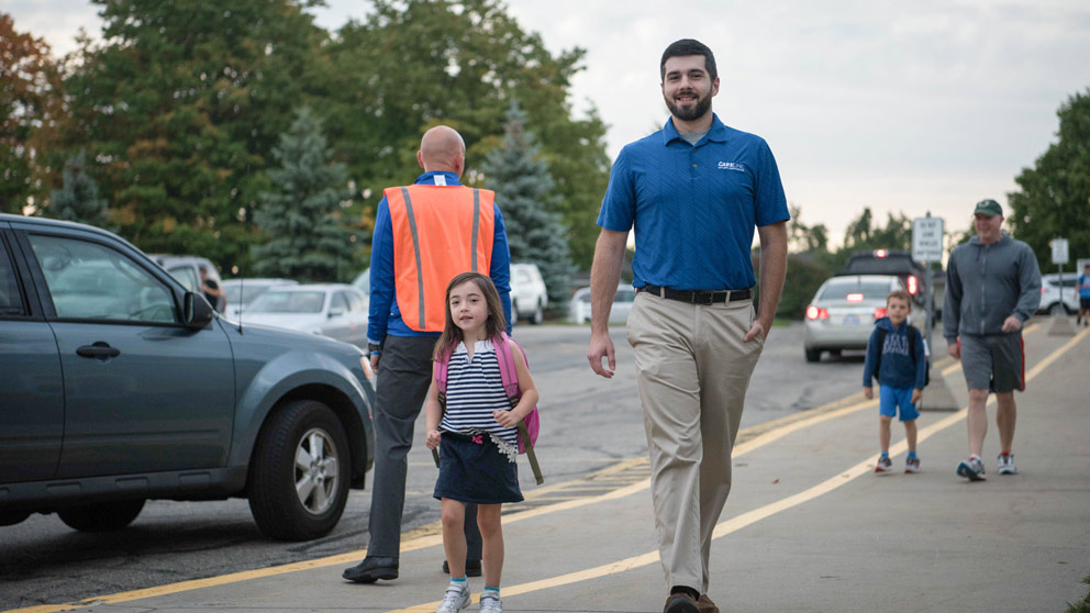 Student, parent, and teacher outside of school