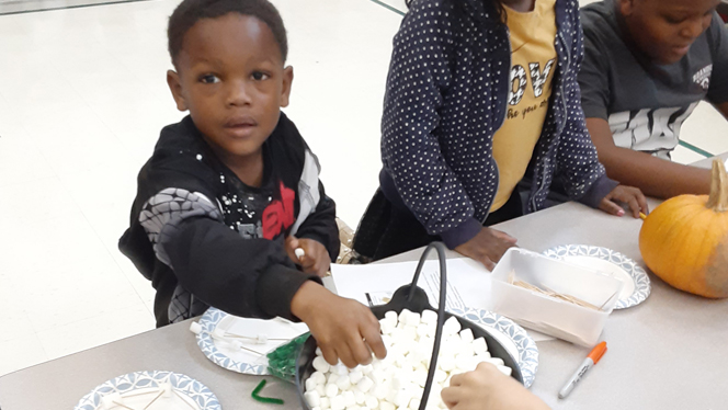 Children building with marshmallows and toothpicks. Children building with marshmallows and toothpicks.