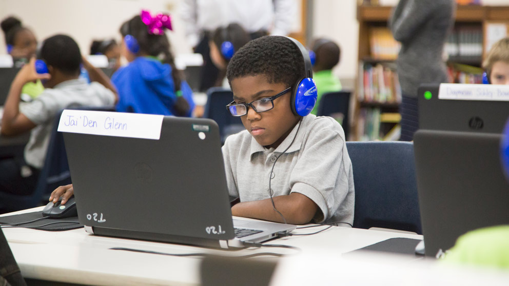 Boy working on laptop