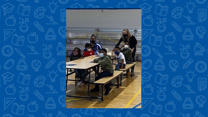 students working in the gym