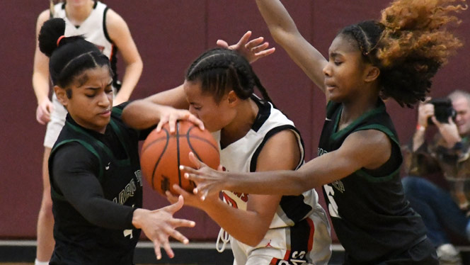 Pernell and Wallace guard a player