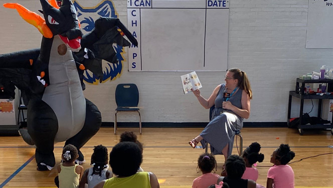 Kindergarten teacher reading to students