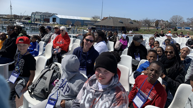 Students and their families sitting and waiting