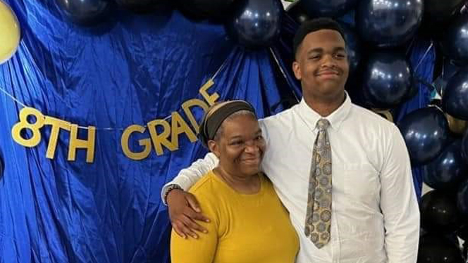 Dean with student at graduation.