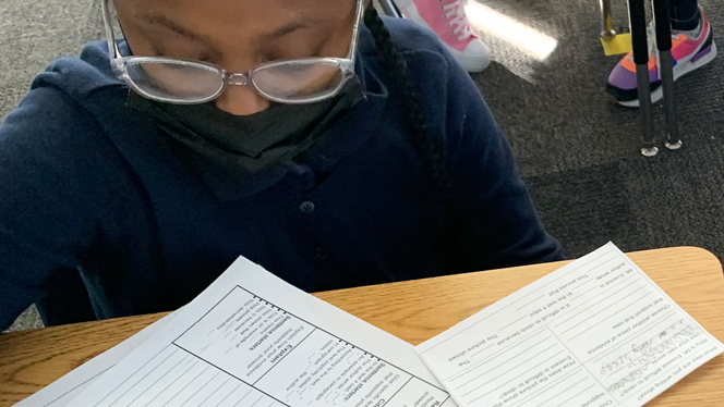 student working on a worksheet
