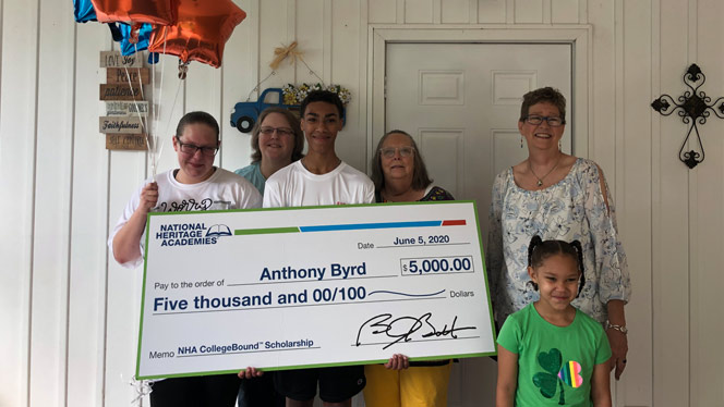 Anthony Byrd holding scholarship with his family Anthony Byrd holding scholarship with his family