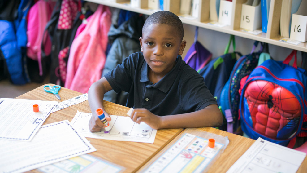 Boy studies in classroom