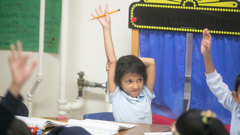 Student raising her hand