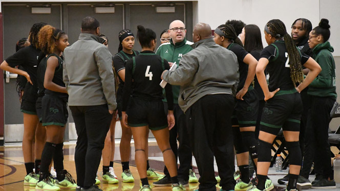 Coach talks with team during time out