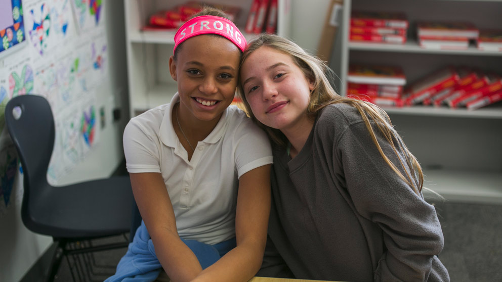 Two students smiling