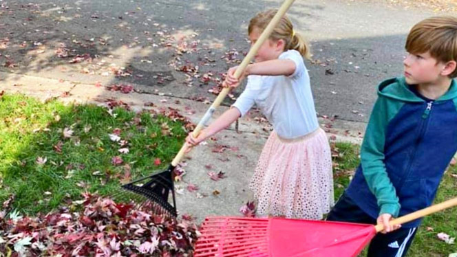 Children raking leaves