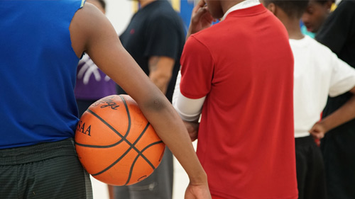 Students playing basketbal.