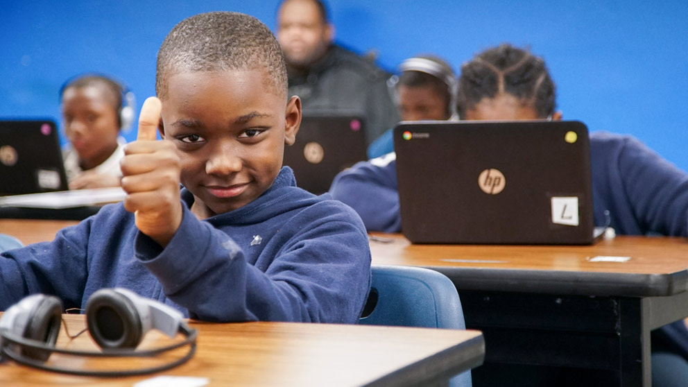 Boy studies in classroom