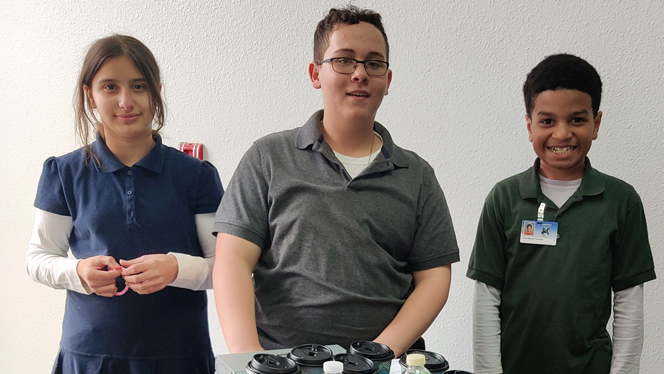 The three students who run the cafe.